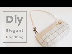 a handbag sitting on top of a white table next to a sign that says diy