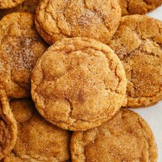 a pile of cookies with powdered sugar on top