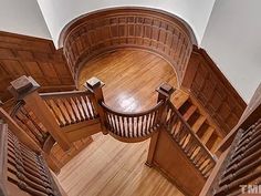 an aerial view of a wooden staircase and banisters