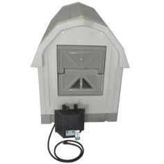 a white dog house with a power cord attached to it