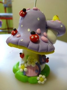 an image of a toy mushroom with ladybugs on it