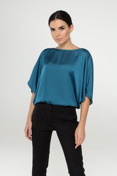 "A soft satin blouse featuring a boat neckline, half dolman sleeves, loose silhouette, and a relaxed fit. - kimono style blouse - loose silhouette - boat neck - half sleeves - Color: blue Fiber: 30% viscose, 70 % polyester. You may feel free choosing the size. Just send us your measurements (bust, waist, hips, height). We will define your correct size. SIZE CHART XS __ EU 34 __ US 4 bust: 31,5\" | 80 cm waist: 24,5\" | 62 cm hips: 34,5\" | 88 cm S __ EU 36 __ US 6 bust: 33,0\" | 84 cm waist: 26, Blue Batwing Sleeve Blouse For Summer, Elegant Batwing Sleeve Party Tops, Blue Summer Blouse With Batwing Sleeves, Chic Boat Neck Top For Work, Chic Blue Satin Blouse, Chic Blouse With Kimono Sleeves For Work, Chic Batwing Sleeve Blouse For Summer, Chic Workwear Blouse With Kimono Sleeves, Summer Boat Neck Blouse