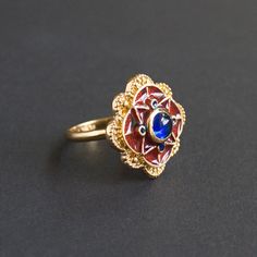 Our version of the luxurious Anglo-Saxon ring found in Escrick, York. This statement ring is dated back to 5-6th century, the Migration period. Its origin was attributed to the Western Europe, possibly France, and it was thought to have belonged to a king, leader or royal consort. Matches to Anglo-Saxon or Frankish early medieval dress. The ring cast from Italian brass, covered with 24k gold plating and adorned with blue glass stone and cold enamel. Size of the top part is about 22x22 mm. Free s Anglo Saxon Jewellery, Antique Enamel Ring, Migration Period, Cold Enamel, Early Medieval, Medieval Times, Antique Ring, Medieval Dress, Anglo Saxon