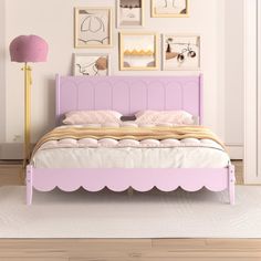 a pink bed with scalloped headboard and foot board in a white room