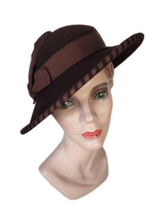 Elegant edged brown felt hat, Made in the U.S.A. by Merrimac. Walk in style with this original.  Condition is very good. Hat can fit many sizes Perfect hat for every occasion.  Wedding, Party, Beach, Picnic, Church, from A to Zone hat, a variety of LOOKS! Add sweet day dress and off to the Gatsby you go. HAT BLOCK/MANNEQUIN NOT INCLUDED Buyer pays all related shipping costs, including insurance. All Sales Final Thank you, CityVintage Formal Brown Hat Bands For Fall, Formal Brown Hat Band For Fall, Brown Formal Hat With Short Brim, Formal Fitted Brown Fedora, Retro Fitted Brimmed Felt Hat, Retro Fedora With Curved Brim, Retro Fitted Fedora With Curved Brim, Fitted Retro Fedora With Curved Brim, Fitted Brown Fedora For Winter