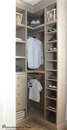 an open closet with clothes and shoes in it