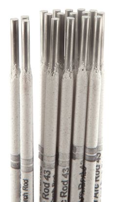 six silver colored crayon pens lined up in a row on a white background