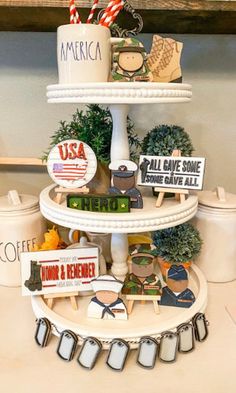 a three tiered cake stand with various items on it's sides and the words america above them