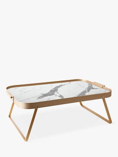 a white marble coffee table with wooden legs and a gold metal frame on the bottom