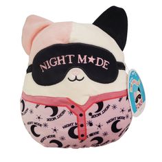 a stuffed animal with a sleeping mask on it's face and the words night made