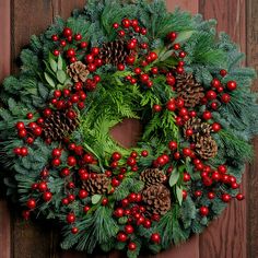 Christmas wreath with metallic red berries, pine cones, bay leaves on fir, pine and cedar base Wreath Business, Fresh Christmas Wreath, Red Christmas Wreath, Fresh Wreath, Fall Thanksgiving Wreaths, Window Wreath, Red Wreath, Berry Wreath, Thanksgiving Wreaths