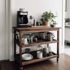 a coffee bar with cups and plates on it