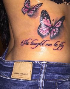 a woman's stomach with two pink butterflies on it and the words, we taught one to fly