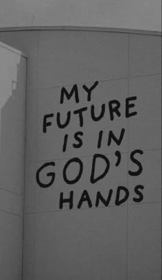 a black and white photo with the words my future is in god's hands