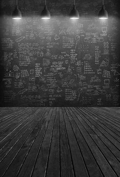 an empty room with wooden floors and chalk writing on the wall