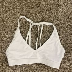 Basic White Sports Bra, Perfect For The Gym Or Walks. Never Worn White Sports Bra For Light Exercise In Summer, Casual White Breathable Sports Bra, Casual White Sports Bra For Light Exercise, White Sports Bra For Light Summer Activities, White Sports Bra For Light Summer Sports, White Sports Bra With Light Support For Spring, White Sports Bra For Spring, White Sporty Sports Bra For Spring, White Light Support Sports Bra For Spring