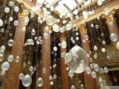 bubbles are floating in the air near columns