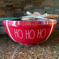 a large red bowl with the word ho ho on it sitting on top of a counter