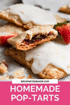 homemade pop tarts with white icing and strawberries on the top are shown