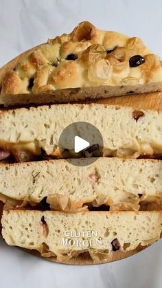 a loaf of bread sitting on top of a wooden cutting board