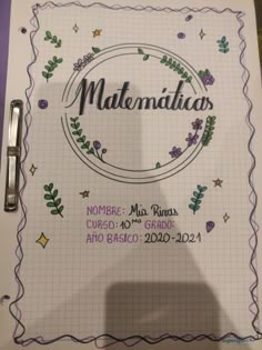 a notebook with the words matrimilan written in spanish and surrounded by flowers