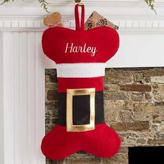 a christmas stocking hanging from a fireplace mantel