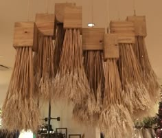 several pieces of straw hanging from the ceiling