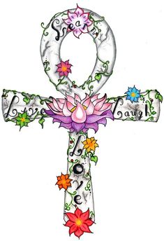 an ornate cross with flowers on it