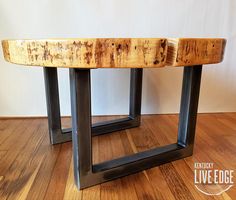 a wooden table sitting on top of a hard wood floor