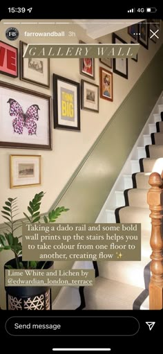 a staircase with pictures on the wall and a quote below