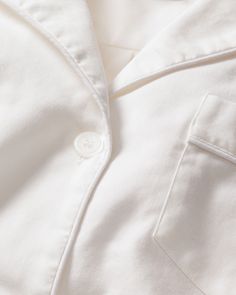 Classic white never goes out of style. Crisp, versatile, and always on-trend. This Classic Short Set is a simple classic white, with white piping and finished with pearl buttons. The fabric is made from 100% of the finest quality cotton. It is yarn-dyed to prevent fade and brushed for added softness making the sleepwear feel absolutely luxurious, getting cozier after each wash. You will be tucked in luxury and off to dreamland. Bonne nuit. Pajama Short Set, Pajama Short, Shoe Size Conversion, Short Pajama Set, Short Set, Pearl Buttons, Pajama Shorts, Shoe Size Chart, Getting Cozy