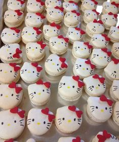 there are many hello kitty cupcakes on the tray