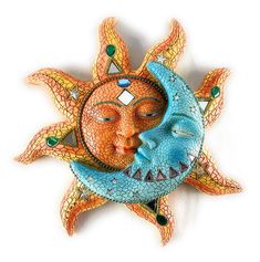 the sun and moon face are made out of mosaic tiles