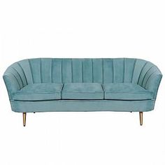 a light blue couch with gold legs