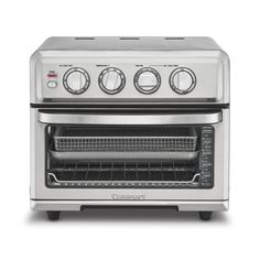 an oven that is silver and has two burners on the front, one with three knobs