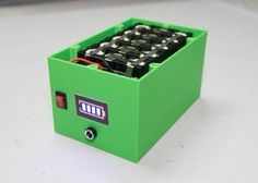 a green box that has some batteries in it