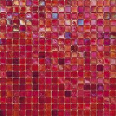 a red and pink mosaic tile wall with lots of small squares on it's surface