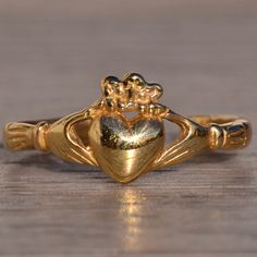 The 123rd Avenue: Yellow Gold Claddagh Ring With Adjustable Shank. This Claddagh Ring Could Be Used As A Mid Finger Ring, Or Toe Ring And Is Crafted In 14 Karat Yellow Gold. The Ring Is Currently A Finger Size 3.5 Yet Has An Open Back So It Can Be Adjusted To Fit Any Size! Mid Finger, Mid Finger Rings, Gold Claddagh Ring, Claddagh Ring, Claddagh Rings, 5 Rings, Toe Ring, Finger Ring, The Ring