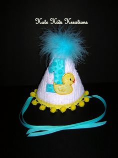 a baby hat with a rubber ducky on it