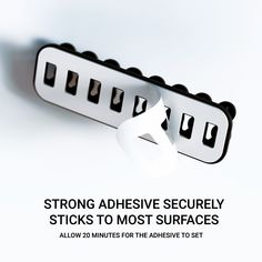 an advertise with the words, strong adhesive securely sticks to most surfaces allow 20 minutes for the adhesive set