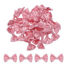 pink satin bows and clips on white background