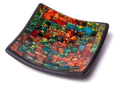 a colorful glass plate on a white surface