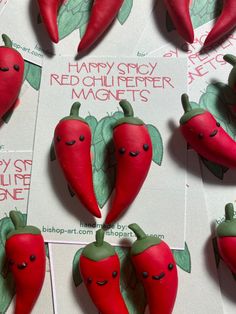 there are many red chili peppers with faces on them and the words happy story, red chilli - fermer magnets