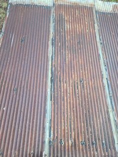 an old metal roof with some rust on it