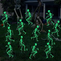 the skeleton lawn decorations glow green in the dark