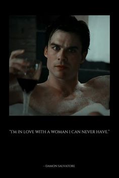 a shirtless man holding a glass of wine in front of a black background with the words, i'm in love with a woman i can never have?