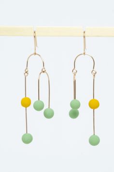 Gold & Porcelain Earrings - Perfectly balanced and exuding kinetic energy, these modern earrings are truly art in movement. An asymmetric, gold-filled wire creates a mesmerizing illusion, while the colorful, porcelain dancing dots add a playful touch. Gold-filled ear wires. Porcelain Earrings, Kinetic Energy, Artful Home, Modern Earrings, Ear Wires, Gold Earrings, Gold Filled, Dancing, Jewelry Earrings