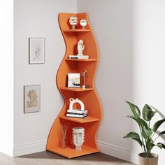 an orange curved shelf in the corner of a room