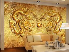 a living room filled with furniture and a golden wall mural behind the couches in front of it