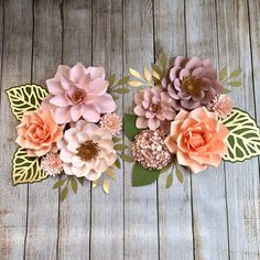 three paper flowers on top of each other